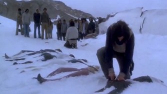 Scene from the movie Alive, dead bodies in the snow